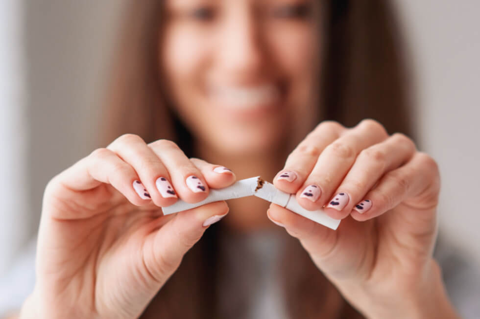 woman breaks the cigarete